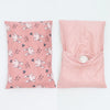 A pink soft cotton baby pillow cover featuring a pattern of little bunny faces.