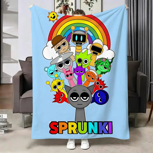 A colorful blanket featuring cartoon characters and a rainbow design.