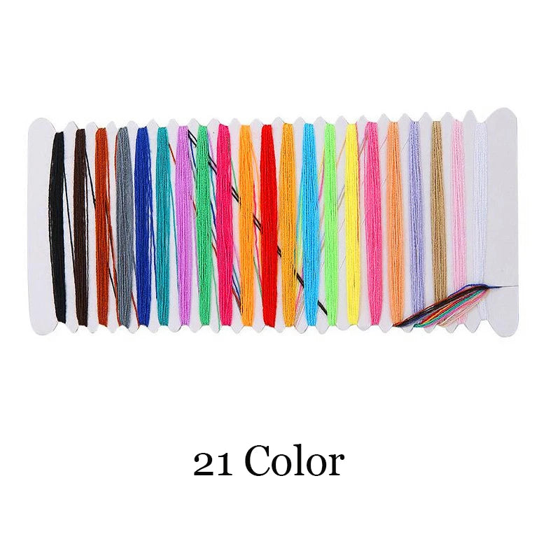 A strip of 21 colored embroidery threads laid out horizontally for hand embroidery practice.