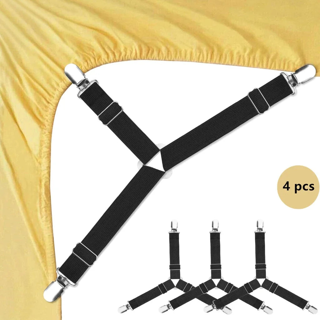A set of four black adjustable triangle bed sheet clips used to secure bedding.