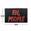 Black embroidered patch with red text EW, PEOPLE and dimensions 5cm by 8cm