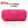Two pink elastic yarn skeins displayed on a white background for crafting