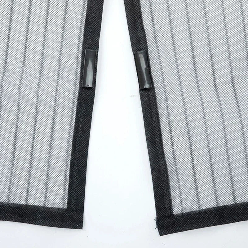 A pair of black automatic mosquito net curtains for doors and windows.