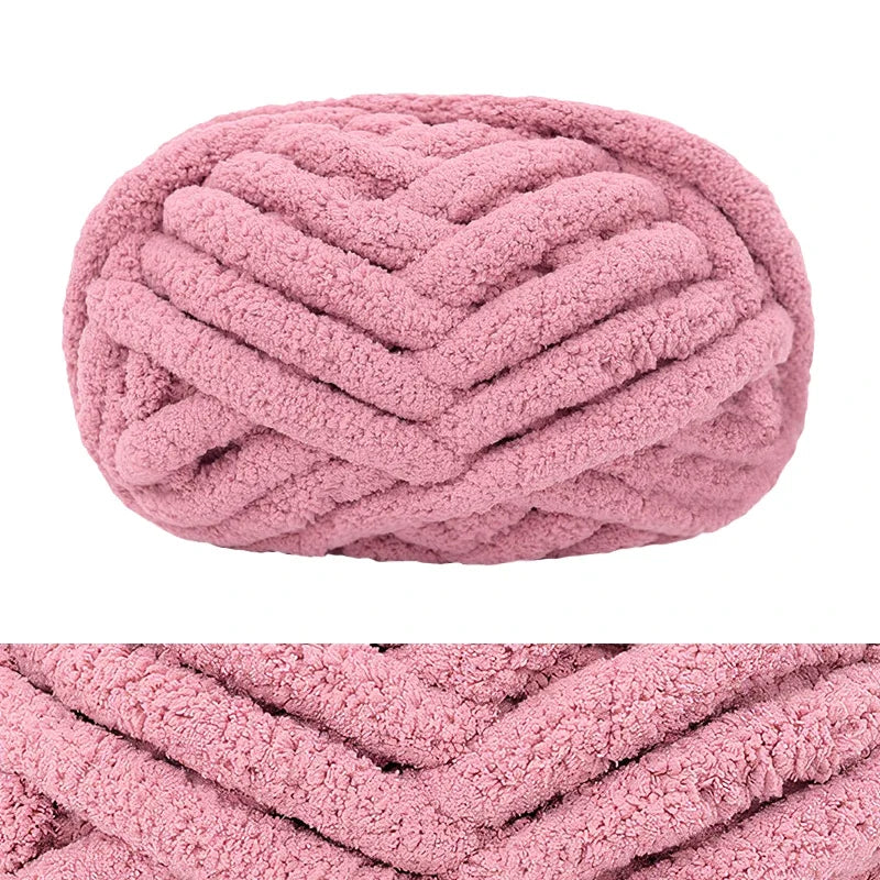 A pink hand-knitted wool finger line scarf with a textured, ribbed pattern.