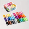A collection of 12 rolls of mixed-color polyester sewing thread in various shades of pink, yellow, green, and brown.