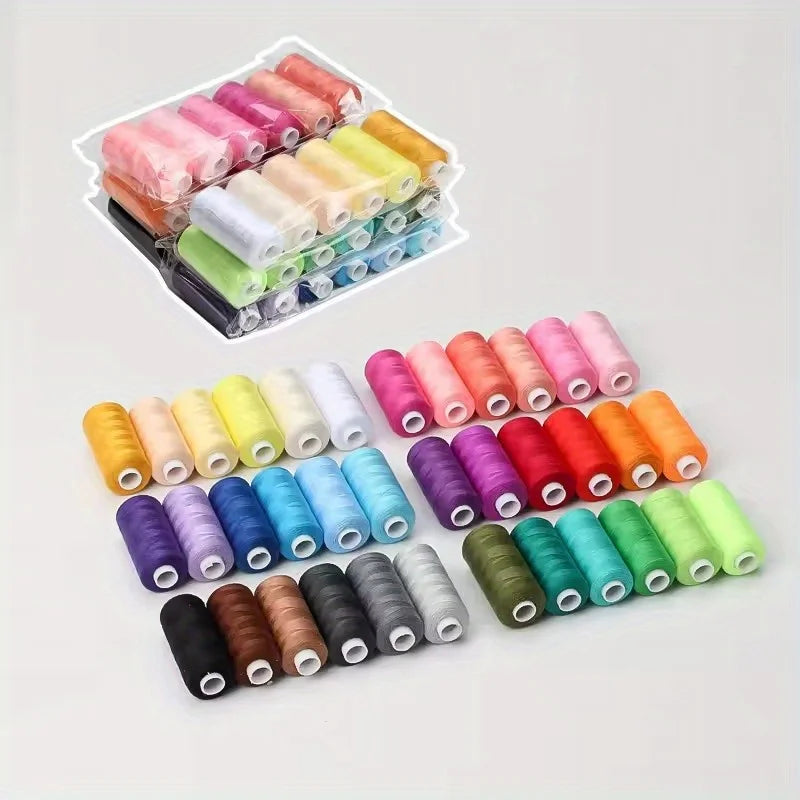 A collection of 12 rolls of mixed-color polyester sewing thread in various shades of pink, yellow, green, and brown.
