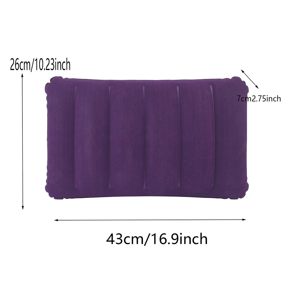 A purple portable inflatable travel pillow shown flat with dimensions 26cm x 43cm.