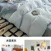 A set of ultra-soft washed cotton quilt bedding featuring light blue and white tones.