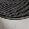 A close-up view of a black half-round non-slip PVC door mat with a diamond pattern placed on a light gray tiled floor.