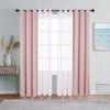 A set of pink sheer and blackout window drapes hanging on a rod in a light gray room.