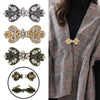 A collection of elegant rhinestone clothing clips and barrettes in silver, gold, and bronze tones.