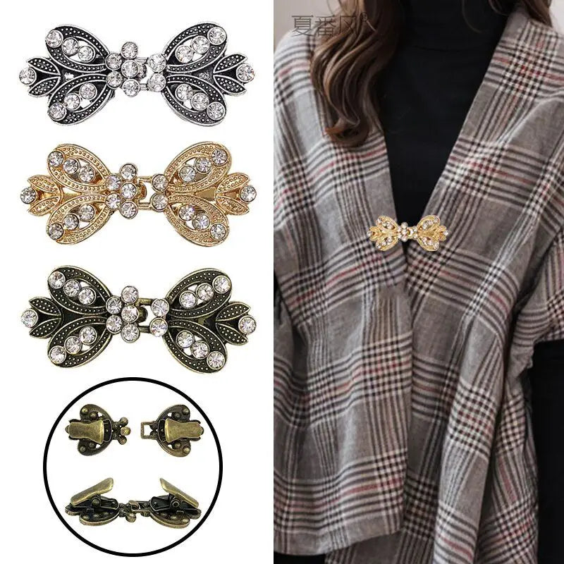 A collection of elegant rhinestone clothing clips and barrettes in silver, gold, and bronze tones.