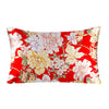 Red silk pillowcase with a floral print featuring white, pink, and yellow flowers.