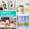 A collection of sublimation paper products including a phone case, mug, and various charms and keychains.