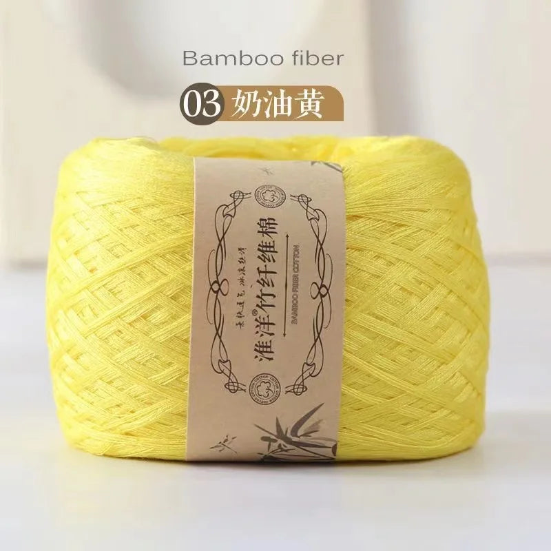Yellow bamboo fiber yarn skein labeled as 03 奶油黃 for crafting