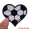 Black heart shaped patch embroidered with a white soccer ball pattern