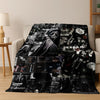 A black horror character flannel throw blanket displayed on a light-colored sofa.