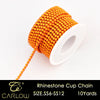 A spool of orange glass rhinestones used to create a cup chain for DIY decoration.