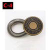A round metal button extender with a serrated edge, used for pants and jeans.