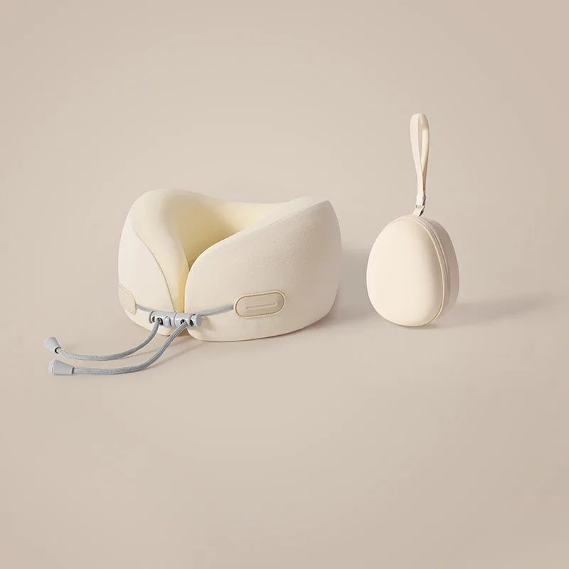 A beige U-shaped memory foam travel neck pillow with a cooling cover and strap is shown on a light background.