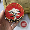 An embroidered patch featuring a white mushroom cloud design on a red background with the text The Future Is Bright.
