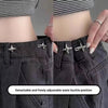Close-up of a person wearing dark denim jeans with a detachable and freely adjustable waist buckle.