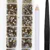 A clear plastic container holds various gold and silver crystal hot fix rhinestones and an applicator tool.