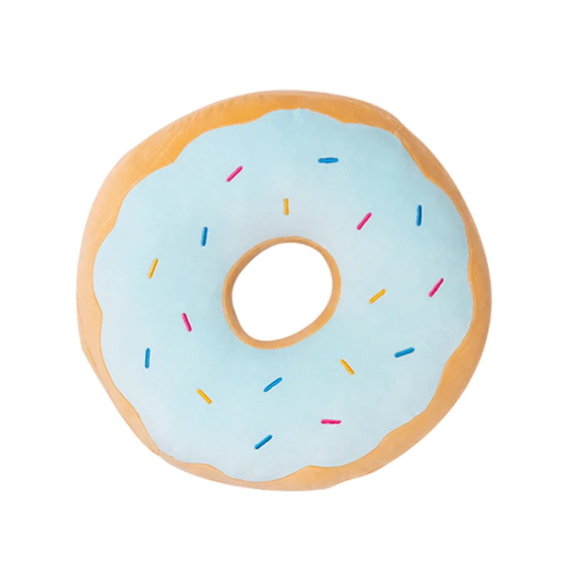 A light blue frosted doughnut-shaped plush pillow with colorful sprinkles.