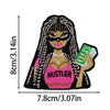 Embroidered patch of a cartoon woman with long braided hair wearing sunglasses and a pink top