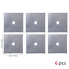 A set of six square metal protectors with circular openings for a gas stove.