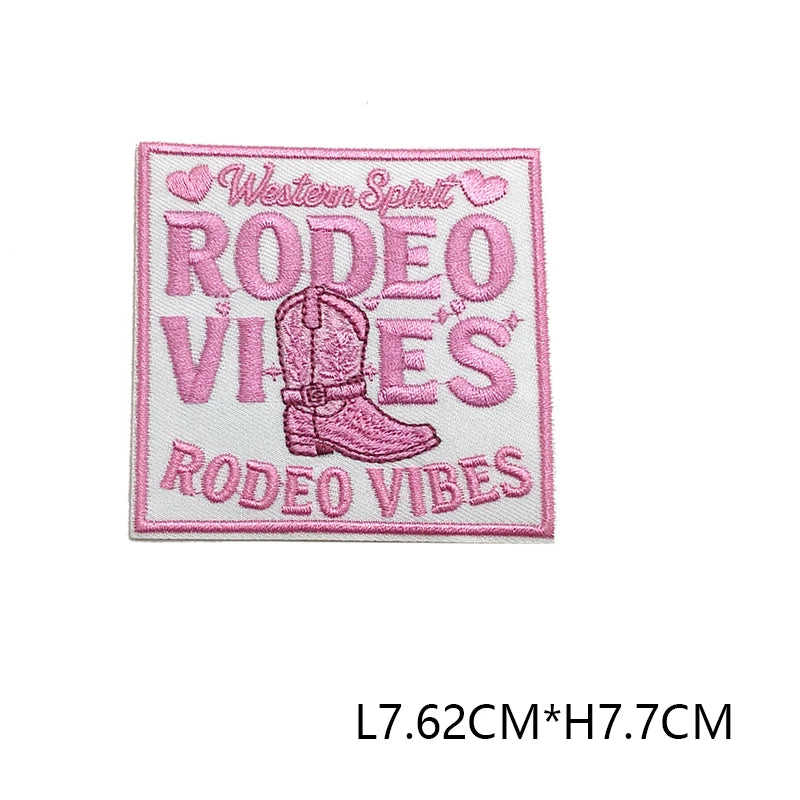 Pink embroidered patch with text Western Spirit Rodeo Vibes