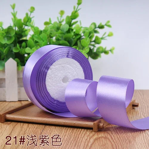 Roll of purple satin ribbon for gift wrapping and DIY crafts