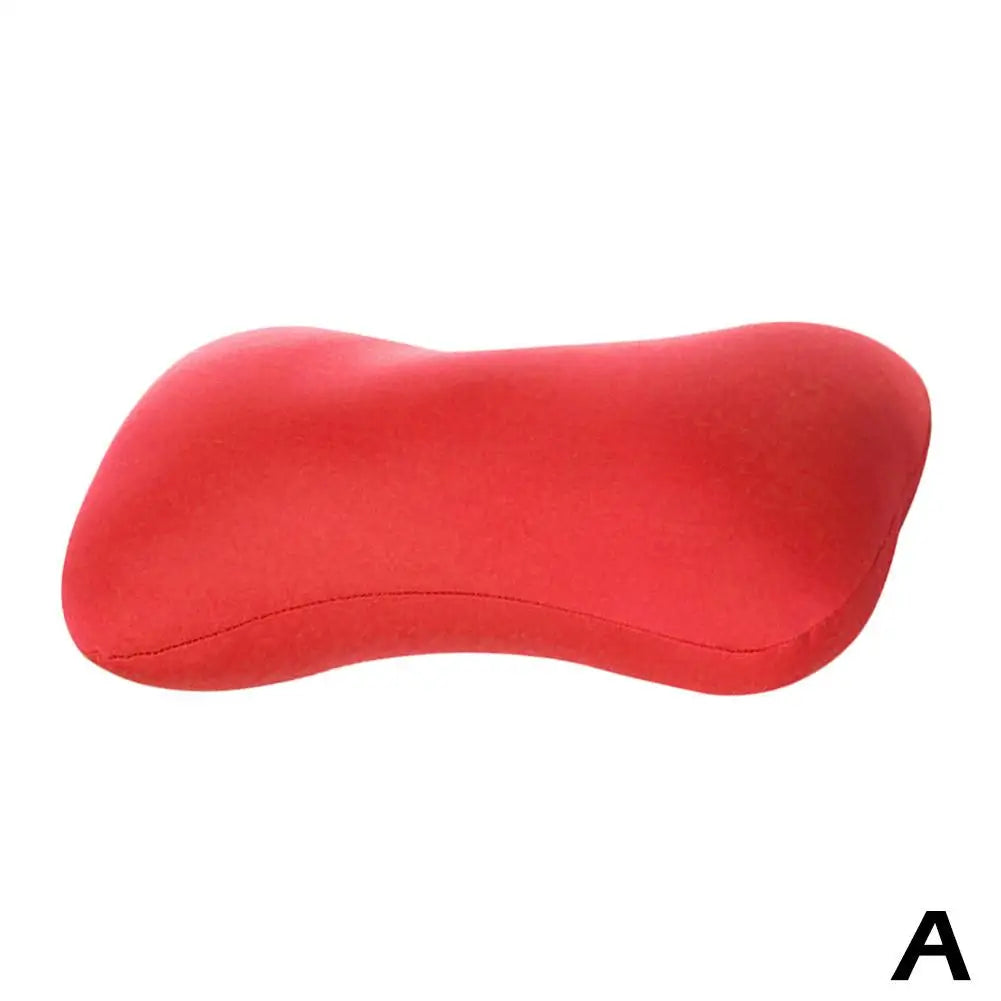 A red microbead neck pillow shown from the side.