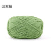 A ball of light green chenille yarn used for knitting and crochet projects.