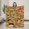 A cozy throw blanket featuring a repeating pattern of anime-style hamburgers and food items.
