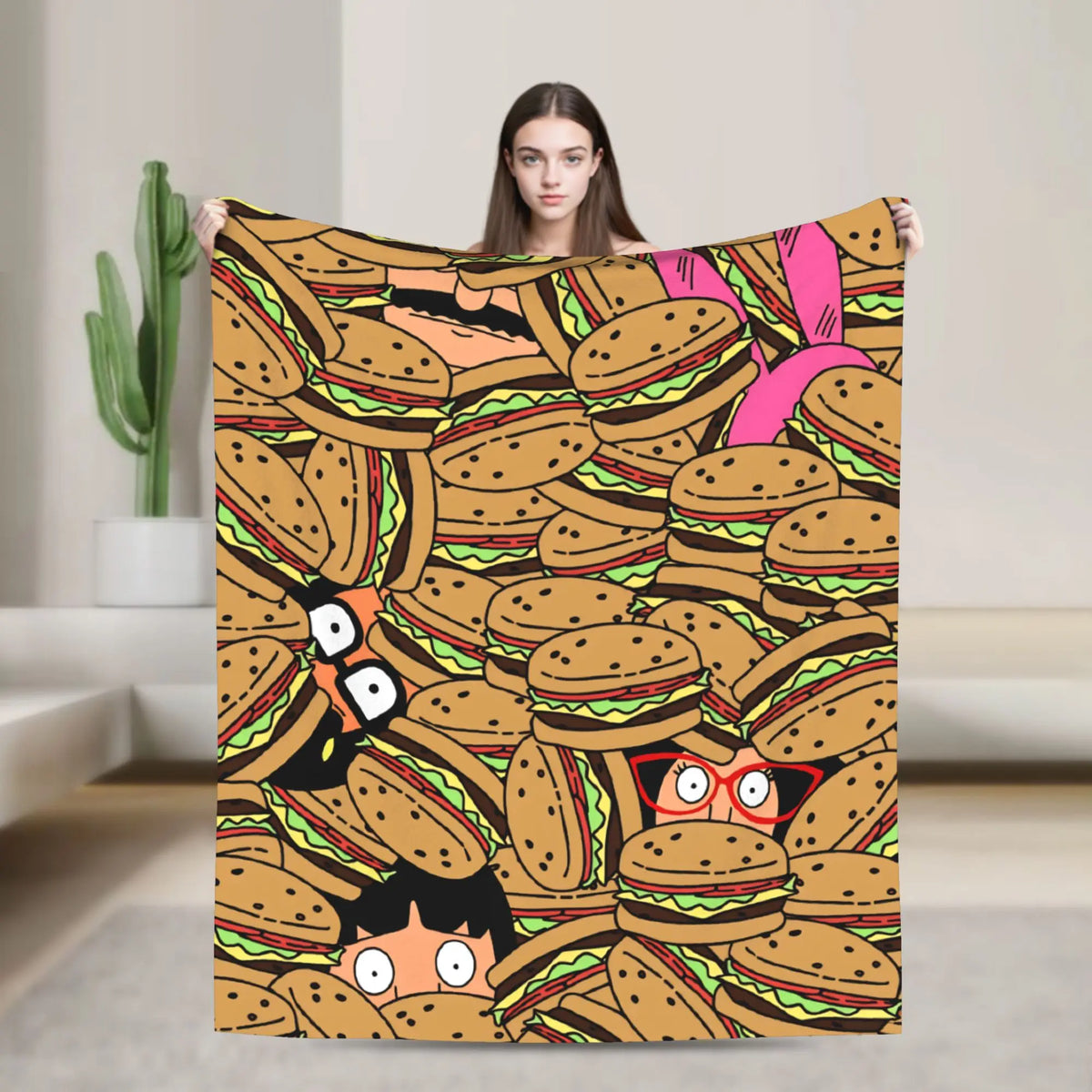 A cozy throw blanket featuring a repeating pattern of anime-style hamburgers and food items.