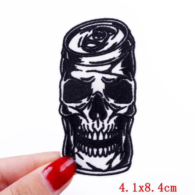 Black embroidery patch featuring a detailed skull design wrapped in a rose motif