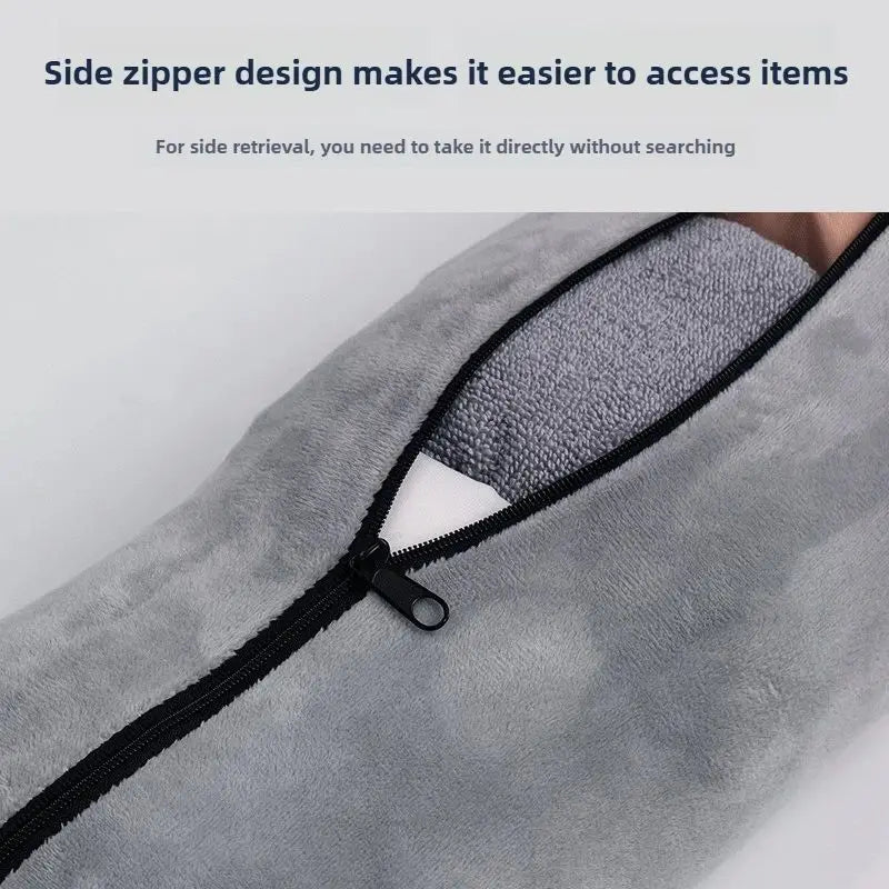 Close-up of a gray fabric travel neck pillow showing a black side zipper for easy access.