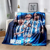 A large blue and white soccer player graphic blanket featuring Lionel Messi in a dynamic pose.