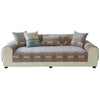 A beige sofa covered in patterned chenille fabric and decorated with various throw pillows.