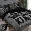 A king size duvet cover set featuring a grey and black pattern with a crown design.