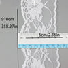 A white decorative lace ribbon roll is shown next to a ruler measuring 910cm and 358.27in.