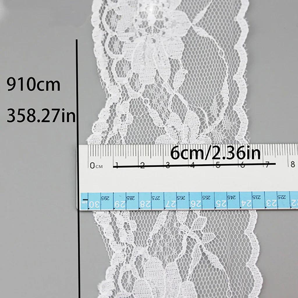 A white decorative lace ribbon roll is shown next to a ruler measuring 910cm and 358.27in.