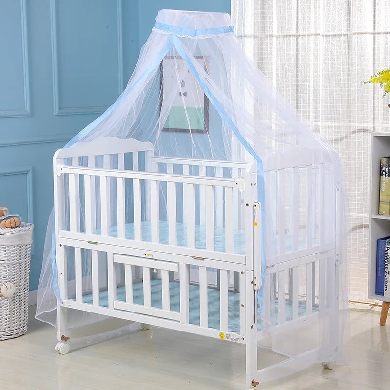 A white foldable baby mosquito net crib canopy with a sheer protective netting over the sides.