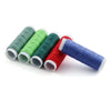 A collection of six spools of industrial sewing thread in various colors including green, lime green, dark green, red, and bl