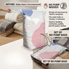 A set of no-pump vacuum storage bags is shown next to bulky items like blankets and clothing.