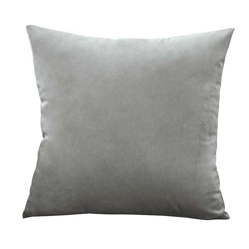 A square velvet throw pillow cover in a solid gray color.