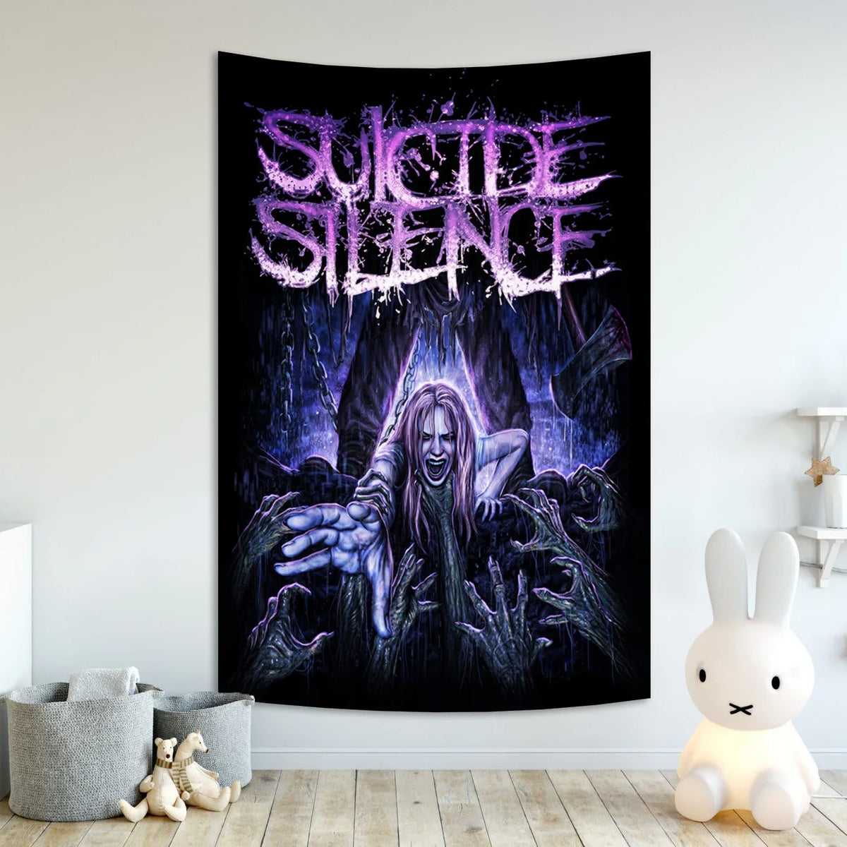 A dark tapestry featuring the band Suicide Silence in purple and black text with a ghostly figure.