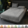 A collection of luxury velvet bedding sets in various colors including orange, pink, yellow, green, and blue.