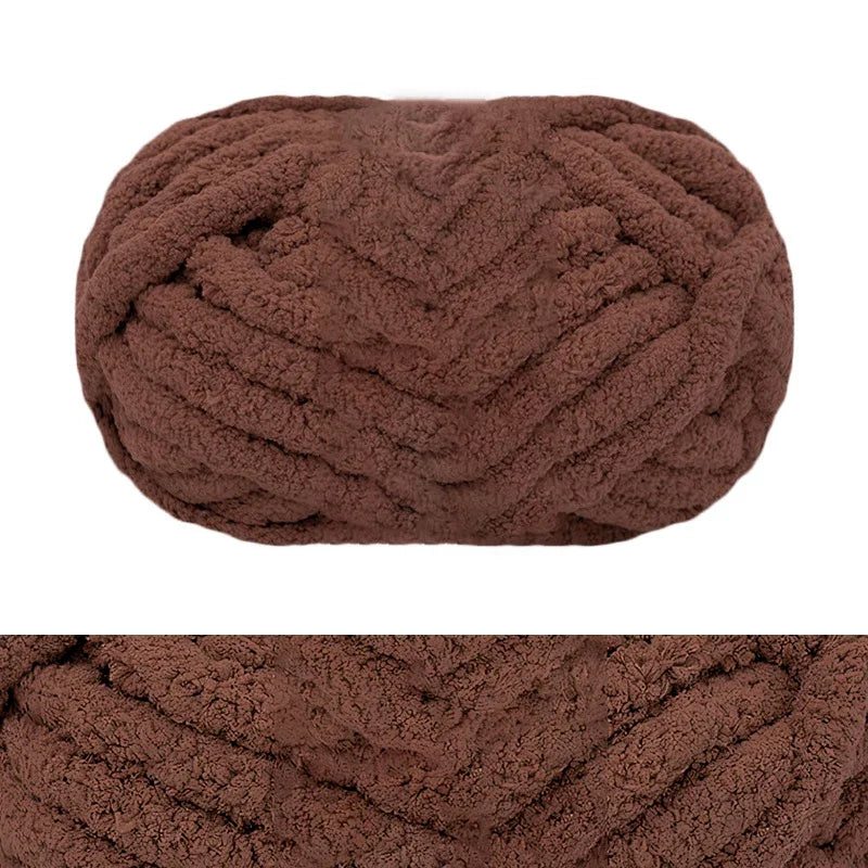 A close-up view of a dark brown hand-knitted wool finger line scarf in a tightly twisted yarn texture.